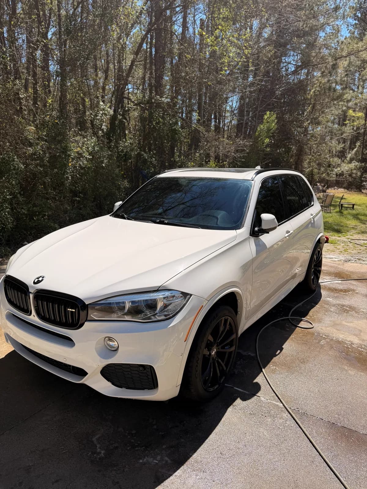 White BMW X5 after a full detail